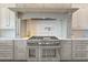Modern kitchen featuring custom cabinets, stainless steel appliances, and a professional-grade range at 1100 Cordova Ne Blvd, St Petersburg, FL 33704