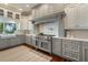 Gourmet kitchen with custom cabinets, stainless steel appliances, and a view to the outdoors at 1100 Cordova Ne Blvd, St Petersburg, FL 33704