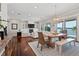 Spacious living room with a fireplace, built-ins, and views of the pool and waterfront at 1100 Cordova Ne Blvd, St Petersburg, FL 33704
