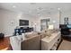 Open living area with hardwood floors features a TV, decor and comfortable furnishings at 1100 Cordova Ne Blvd, St Petersburg, FL 33704