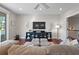 Inviting living room features a large TV, comfortable sofa and natural light at 1100 Cordova Ne Blvd, St Petersburg, FL 33704