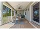 The outdoor dining area features a grill and a long table with six chairs at 1100 Cordova Ne Blvd, St Petersburg, FL 33704
