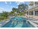 Backyard pool with jacuzzi has nice landscaping and bay view at 1100 Cordova Ne Blvd, St Petersburg, FL 33704