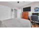Bedroom with closet, dresser, and television at 1259 Ribolla Dr, Palm Harbor, FL 34683