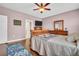 Bright bedroom with ceiling fan and hardwood floors at 1259 Ribolla Dr, Palm Harbor, FL 34683