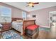 Comfortable bedroom features wood floors and a ceiling fan at 1259 Ribolla Dr, Palm Harbor, FL 34683