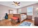 Serene bedroom with wood floors, comfortable bed, dresser, and ample natural light at 1259 Ribolla Dr, Palm Harbor, FL 34683