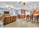 Bright living room featuring an open layout, bar seating, and tile flooring at 1259 Ribolla Dr, Palm Harbor, FL 34683