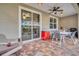 Screened patio area with brick flooring, a ceiling fan, and an outdoor dining set at 1259 Ribolla Dr, Palm Harbor, FL 34683