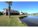 Water view with large yard and covered patio at 130 Water Oak Way, Oldsmar, FL 34677