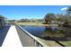 Scenic balcony view overlooking a pond and golf course in a lush green community at 130 Water Oak Way, Oldsmar, FL 34677