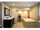 Modern bathroom with soaking tub, tiled shower, and sleek vanity with great lighting at 130 Water Oak Way, Oldsmar, FL 34677