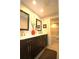 Bathroom features a double vanity with dark wood cabinets and a separate tub at 130 Water Oak Way, Oldsmar, FL 34677