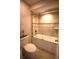 A clean bathroom features a shower over tub and white toilet at 130 Water Oak Way, Oldsmar, FL 34677