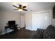Comfortable bedroom with ceiling fan, wood flooring, and closet space at 130 Water Oak Way, Oldsmar, FL 34677