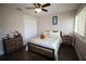 Bedroom with bright windows, hard wood floors and comfortable bedding at 130 Water Oak Way, Oldsmar, FL 34677