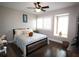 Bedroom with bright windows, hard wood floors and comfortable bedding at 130 Water Oak Way, Oldsmar, FL 34677