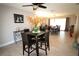 Bright dining room with tile flooring, black table and chairs, and natural light at 130 Water Oak Way, Oldsmar, FL 34677