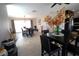 Open dining room with modern lighting and tiled flooring provides an inviting space for Gathering gatherings at 130 Water Oak Way, Oldsmar, FL 34677