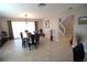 Dining room featuring sleek floors and a staircase in the background, blending modern comfort and style at 130 Water Oak Way, Oldsmar, FL 34677