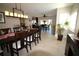 The dining room is spacious with a large table, stylish lighting, and easy access to the outdoor spaces at 130 Water Oak Way, Oldsmar, FL 34677