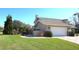 Charming two-story home with a well-maintained lawn and a convenient two-car garage at 130 Water Oak Way, Oldsmar, FL 34677