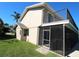 Exterior view of home with screened in porch and balcony at 130 Water Oak Way, Oldsmar, FL 34677