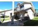 Beautifully landscaped front exterior with stone accents and covered entry at 130 Water Oak Way, Oldsmar, FL 34677