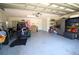 Large garage with room for a golf cart, workbench and storage at 130 Water Oak Way, Oldsmar, FL 34677