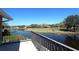 Scenic view of the golf course from the home's balcony with golf carts on green at 130 Water Oak Way, Oldsmar, FL 34677