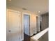 Bright hallway with multiple doors, leading to various rooms within the home at 130 Water Oak Way, Oldsmar, FL 34677