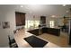 Spacious kitchen featuring granite countertops, stainless appliances and a view into the dining area at 130 Water Oak Way, Oldsmar, FL 34677