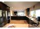 Spacious kitchen featuring stainless refrigerator, dark wood cabinetry, and tile flooring at 130 Water Oak Way, Oldsmar, FL 34677