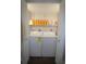 Laundry room with side by side washer and dryer, and shelving above at 130 Water Oak Way, Oldsmar, FL 34677