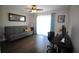 Cozy living room with natural light, ceiling fan, and elegant wood flooring at 130 Water Oak Way, Oldsmar, FL 34677