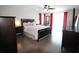 Spacious main bedroom with hardwood floors, natural light, and modern furnishings at 130 Water Oak Way, Oldsmar, FL 34677