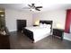 Serene main bedroom featuring hardwood floors, warm lighting, and a ceiling fan at 130 Water Oak Way, Oldsmar, FL 34677