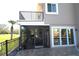 View of patio, screened in porch with ceiling fans and view of pool at 130 Water Oak Way, Oldsmar, FL 34677