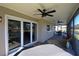 Enjoy a relaxing outdoor space on this screened lanai with a ceiling fan at 130 Water Oak Way, Oldsmar, FL 34677