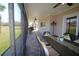 Relax on this comfortable screened patio with an outdoor dining set at 130 Water Oak Way, Oldsmar, FL 34677