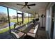 Enjoy the outdoors on this covered patio with a water view at 130 Water Oak Way, Oldsmar, FL 34677