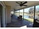 Unwind in this expansive screened patio with a water view and comfortable seating at 130 Water Oak Way, Oldsmar, FL 34677