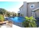 Inviting in-ground pool with brick paver deck and lounge chairs, perfect for outdoor relaxation at 130 Water Oak Way, Oldsmar, FL 34677