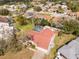 This aerial image showcases a charming neighborhood with a property featuring a pool, lush landscaping, and ample privacy at 13542 Summerwood Ct, Hudson, FL 34667