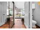 A bathroom vanity with white cabinets is reflected in a mirrored closet door at 13542 Summerwood Ct, Hudson, FL 34667