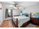 Cozy bedroom with neutral walls, dark trim, and a ceiling fan at 13542 Summerwood Ct, Hudson, FL 34667