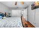 Bedroom with tiled floors, ceiling fan, and en-suite bathroom at 13542 Summerwood Ct, Hudson, FL 34667