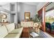 Bright living room with high ceilings, neutral tones, and sliding door access to the outdoor living area at 13542 Summerwood Ct, Hudson, FL 34667