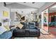 The living room offers an open floor plan and access to the outdoor screened lanai at 13542 Summerwood Ct, Hudson, FL 34667