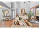 Spacious living room featuring tile flooring, light walls and access to backyard at 13542 Summerwood Ct, Hudson, FL 34667